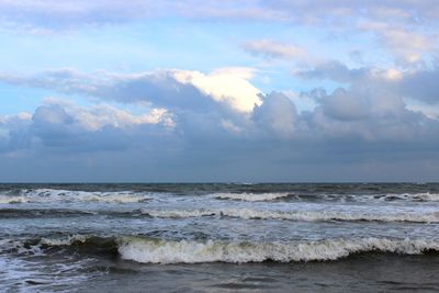 Scenic view of sea against cloudy sky