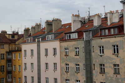 Houses in city against sky