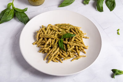 High angle view of pasta in plate on table