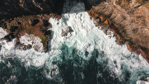 High angle view of rock formation in sea