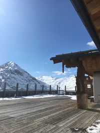 View of snowcapped mountain against blue sky