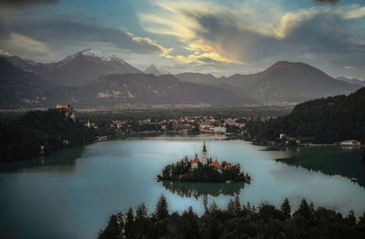 Scenic view of lake and mountains against sky