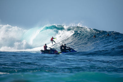 People on boat against sea