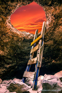 Scenic view of rock formation in sea against sky