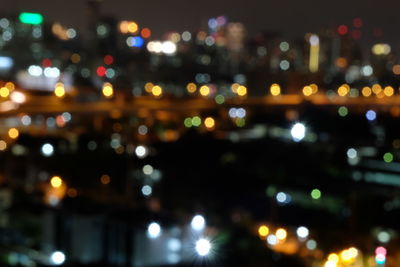 Defocused image of illuminated city at night
