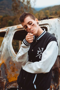 Full length of young man standing outdoors