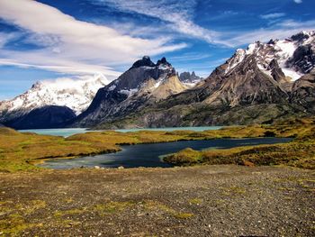 Scenic view of lake and mountains against sky