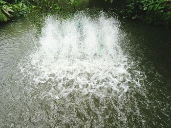 High angle view of water splashing in sea