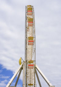 Low angle view of ferris wheel against sky
