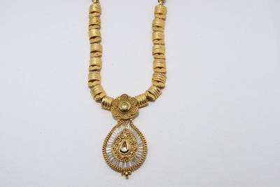 Close-up of cross against white background