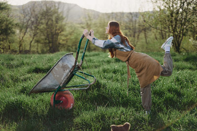 Rear view of man working on field