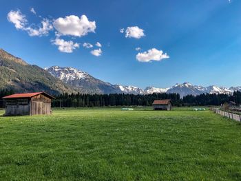 House on field against sky