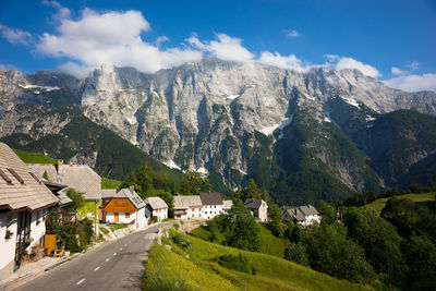 Panoramic view of buildings and mountains against sky