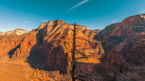 Rock formations on mountain against sky