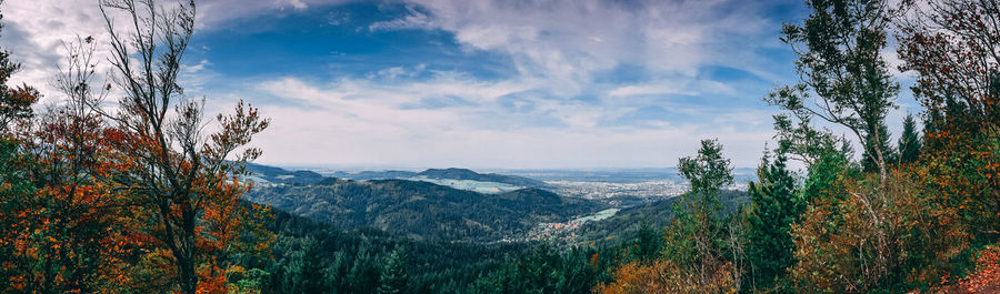 Scenic view of tree mountains against sky