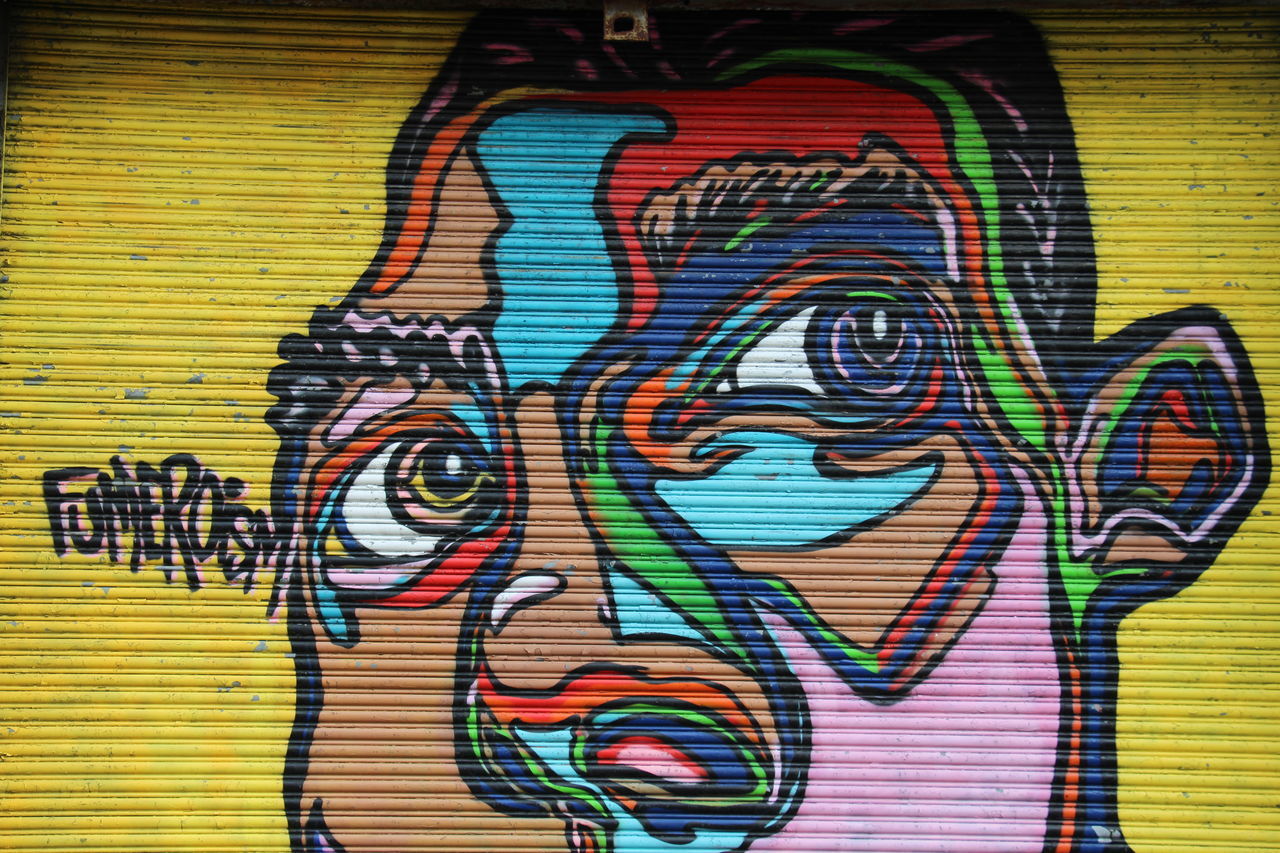 CLOSE-UP OF GRAFFITI ON WALL