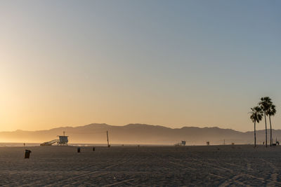 Scenic view of sea against clear sky during sunset