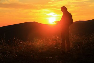 Man standing at sunset