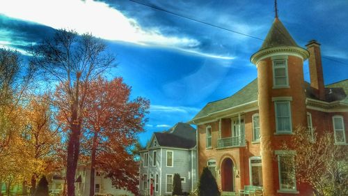 Low angle view of clock tower against sky