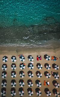 High angle view of deck chairs on beach