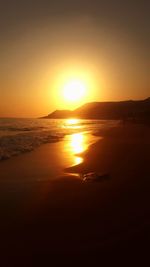 Scenic view of sea against clear sky during sunset