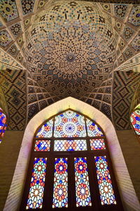 Low angle view of stained glass window in temple