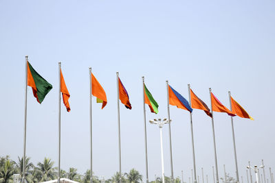 Multi colored flags against clear sky