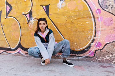 Portrait of young woman standing on street