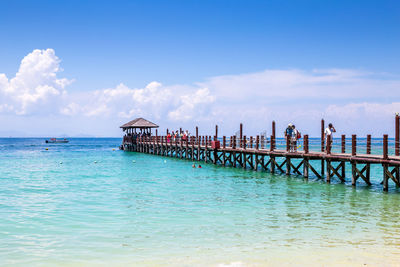 Pier on sea against sky