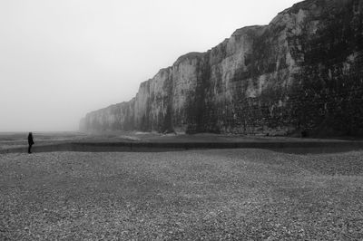 Side view of man standing on shore