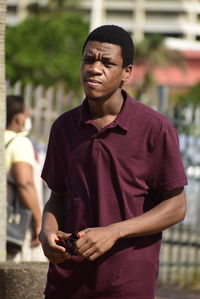 Young man standing outdoors