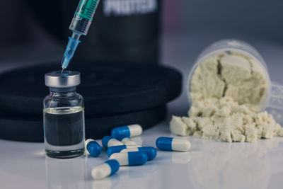 Close-up of medicine and pills on table