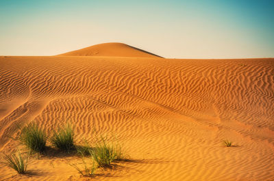 Scenic view of desert against clear sky