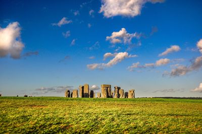 Panoramic view of field and history against sky