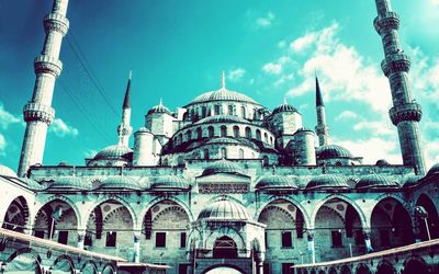 Low angle view of mosque against sky