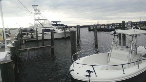 Boats moored at harbor