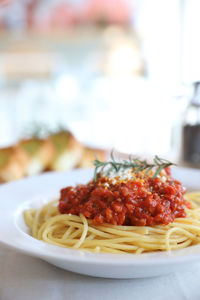 Close-up of pasta served in plate on table