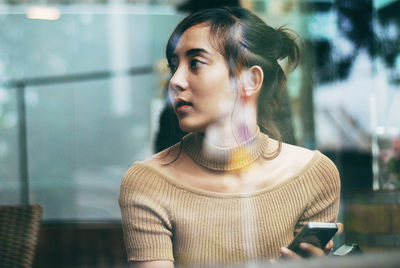 Portrait of mid adult man standing in city