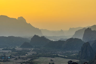 Scenic view of mountains against sky during sunset