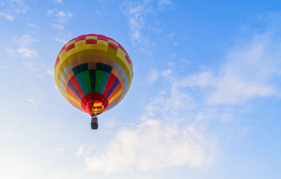 Low angle view of hot air balloons against sky