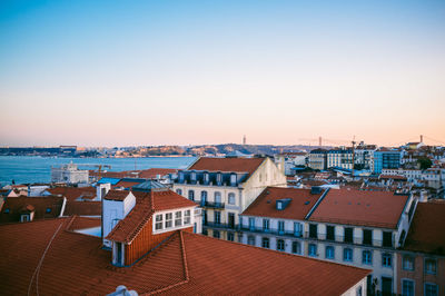 View of cityscape against blue sky