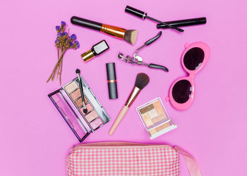 High angle view of beauty products on pink background