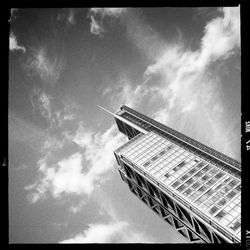 Low angle view of building against cloudy sky