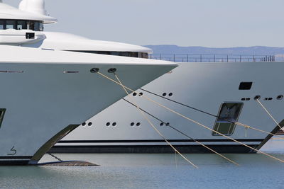 Ship moored on sea against sky