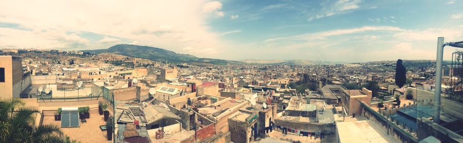 Panoramic view of cityscape against sky