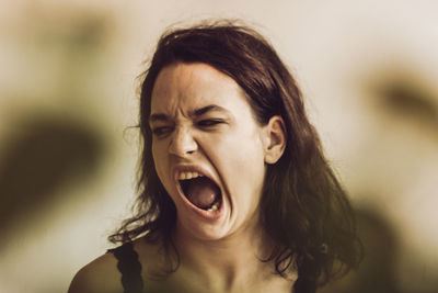 Close-up of young woman making a face