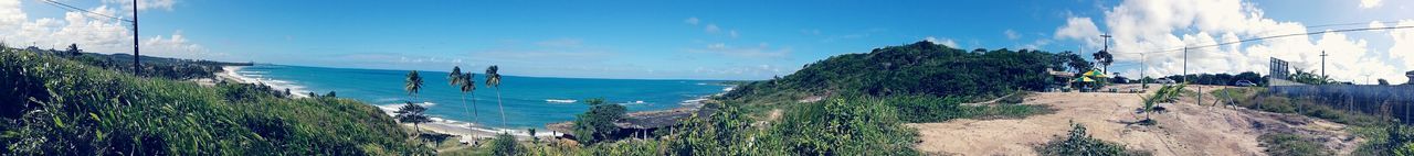 Panoramic view of sea against blue sky