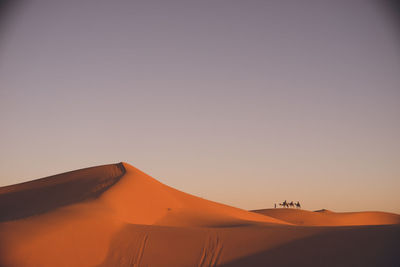 Scenic view of desert against clear sky