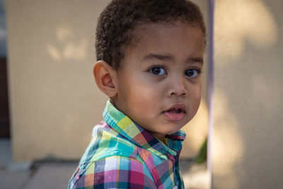 Portrait of cute boy looking away