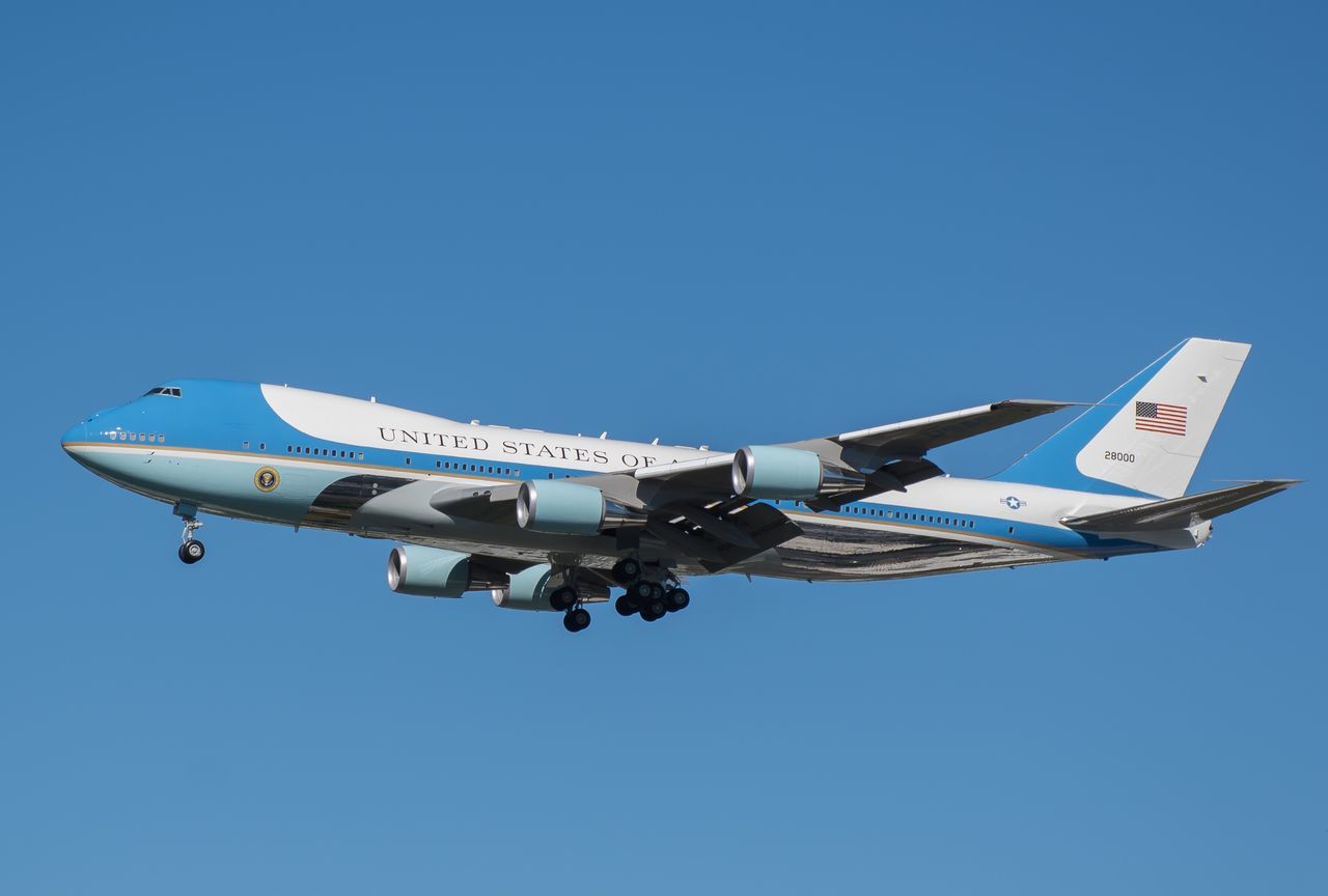 transportation, clear sky, airplane, air vehicle, mode of transport, copy space, low angle view, blue, travel, flying, journey, on the move, day, outdoors, communication, part of, aircraft wing, no people, public transportation, mid-air